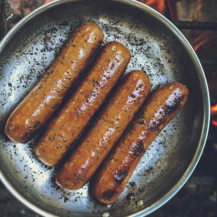 Brats Cooking In Pan